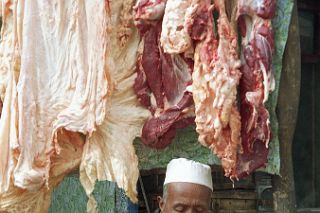 47 Kashgar Sunday Market 1993 Man Making Meat Dumplings.jpg